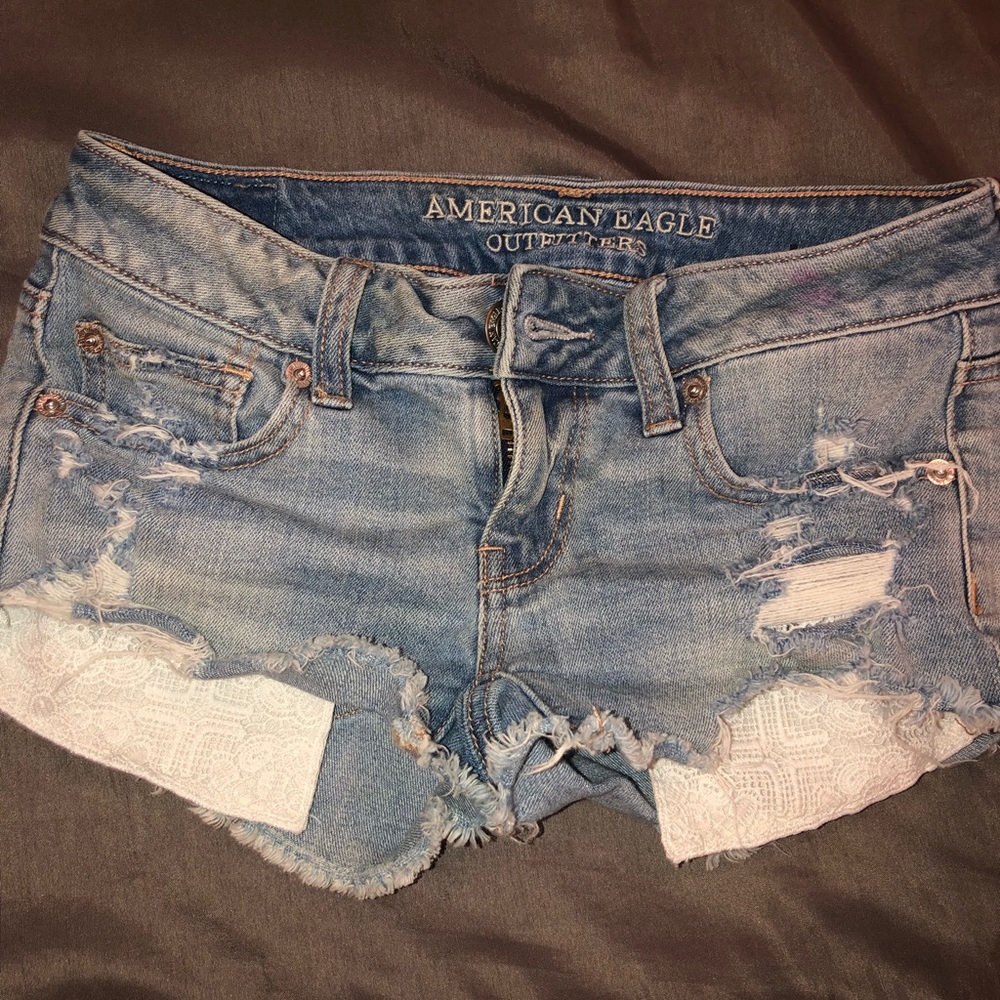 Light blue distressed jean shorts.